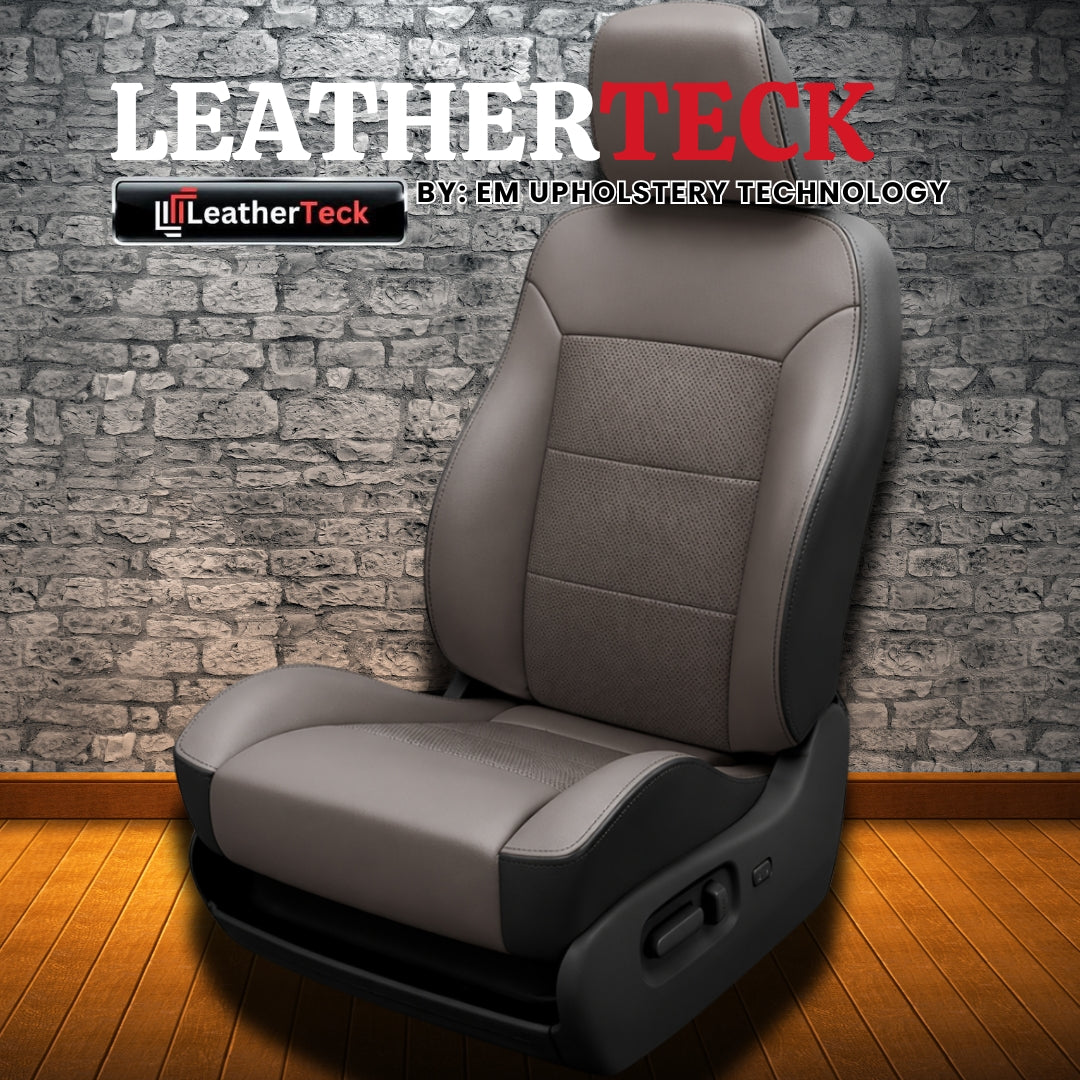 Leatherteck-branded promo image for a 2007 Chrysler Aspen Katzkin Leatherteck leather seat cover upholstery kit (K3, K3763-100) featuring black outer bolsters, light gray facing panels, perforated inserts, and black stitching, shown on a wood floor against a gray brick wall with LEATHERTECK, the LeatherTeck logo, and “BY: EM UPHOLSTERY TECHNOLOGY” text.